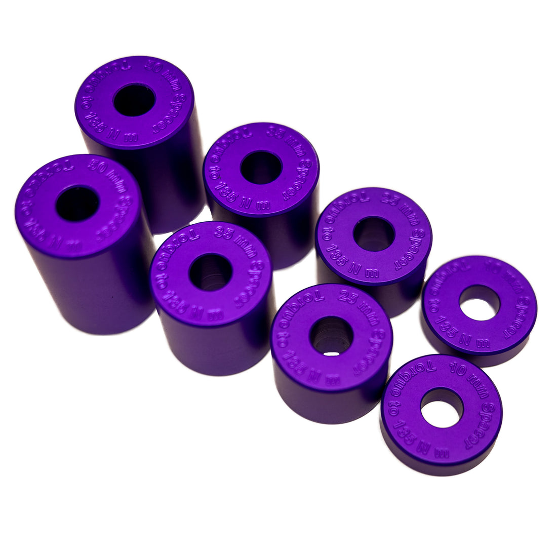 Purple suspension bushings and metal bolt set in foam packaging inside an open black box.
