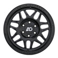 Black alloy off-road wheel with multi-spoke design and engraved branding around the rim.
