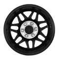 Black multi-spoke alloy wheel with silver center and exposed lug holes
