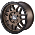 Bronze alloy off-road wheel with black outer lip and multi-spoke design