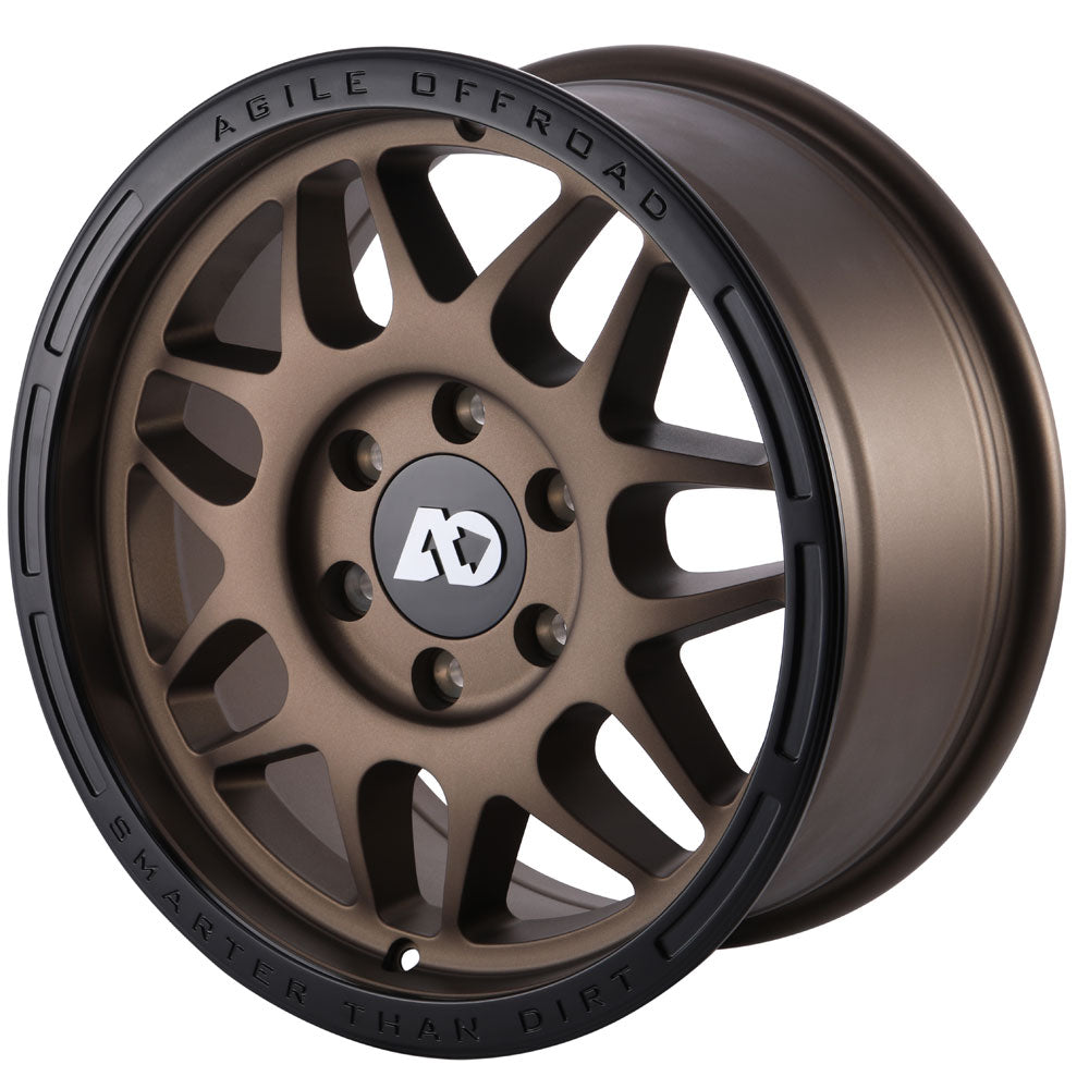 Bronze alloy off-road wheel with black outer lip and multi-spoke design