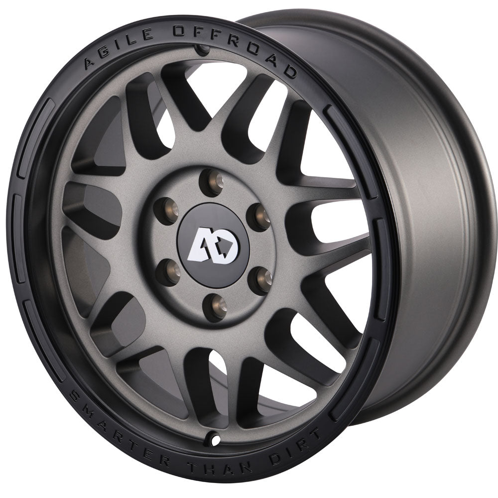 Matte black alloy off-road wheel with multi-spoke design and embossed rim lettering.