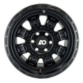 Black off-road wheel rim with multi-spoke design and bold center cap logo.