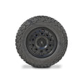 Black off-road tire with rugged tread and multi-spoke alloy wheel viewed from the side.