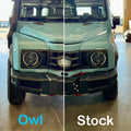 Comparison of aftermarket Owl grille with lights vs stock grille on a light blue off-road vehicle.