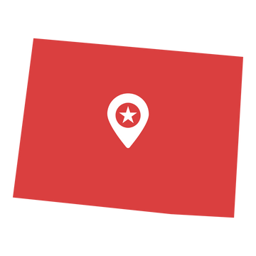 Red sticker with white map pin and star in the center