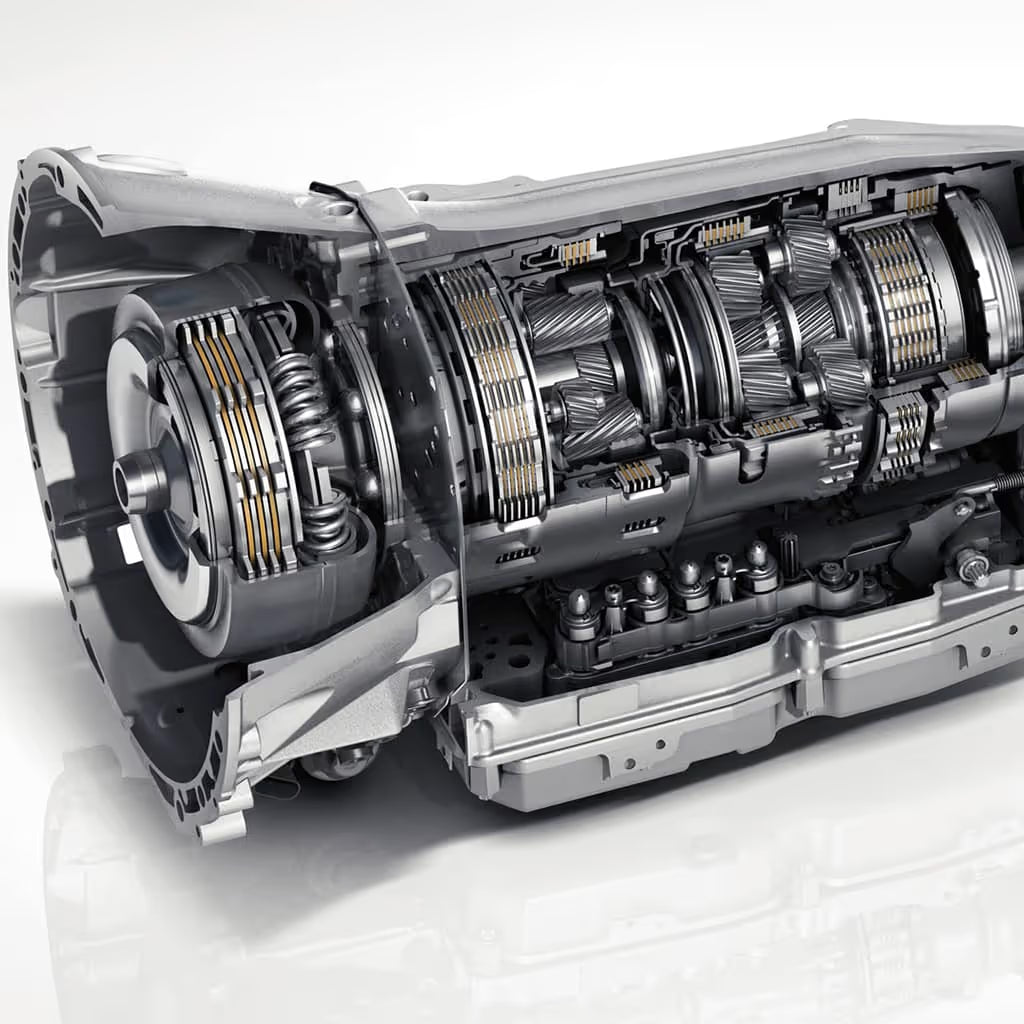 Cutaway view of an automatic transmission showing internal gears and mechanical components.
